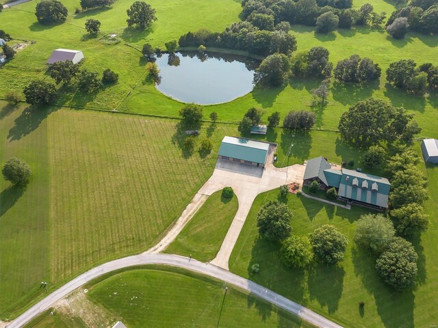 drone / aerial view with a water view and a rural view