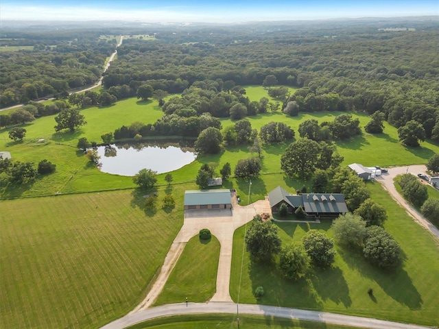 birds eye view of property with a rural view and a water view