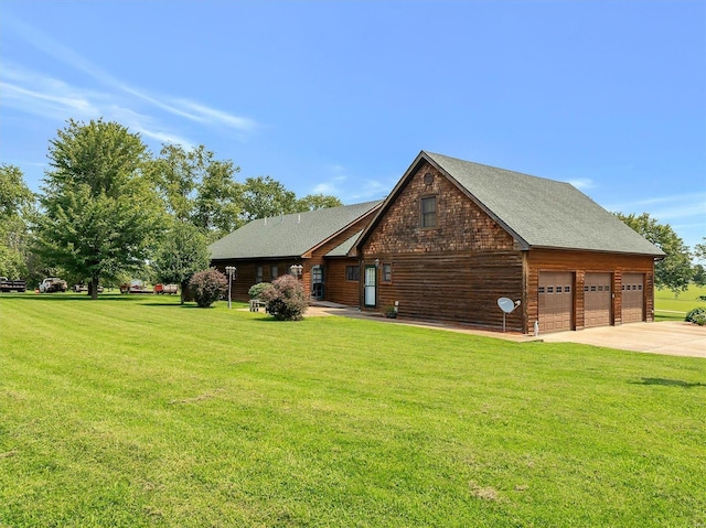 log cabin featuring a garage and a front yard