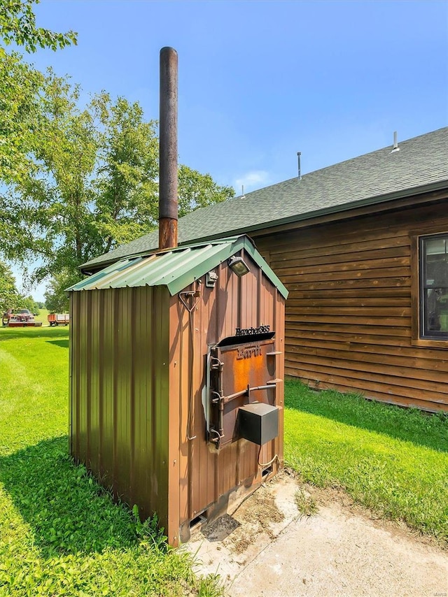 view of outbuilding with a yard