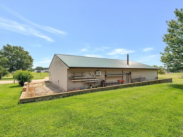 back of property featuring a yard