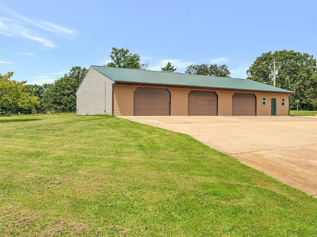 garage featuring a yard