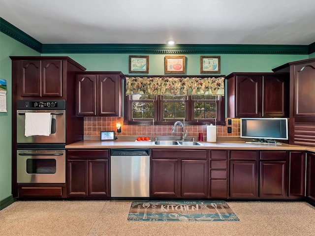 kitchen featuring stainless steel appliances, tasteful backsplash, sink, and crown molding