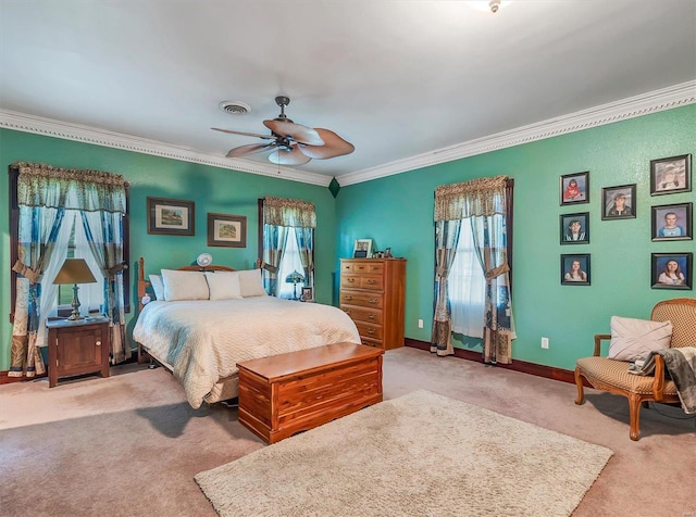 bedroom featuring crown molding, light colored carpet, and ceiling fan