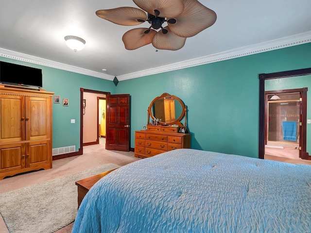 carpeted bedroom with crown molding, ceiling fan, and ensuite bathroom