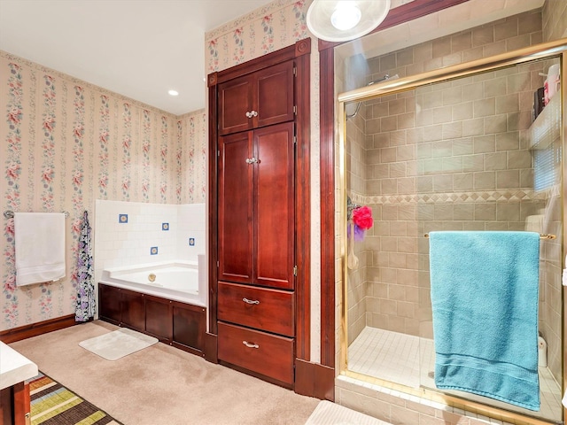 bathroom with separate shower and tub