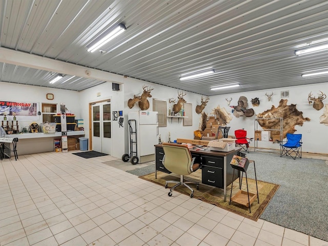 misc room with tile patterned floors