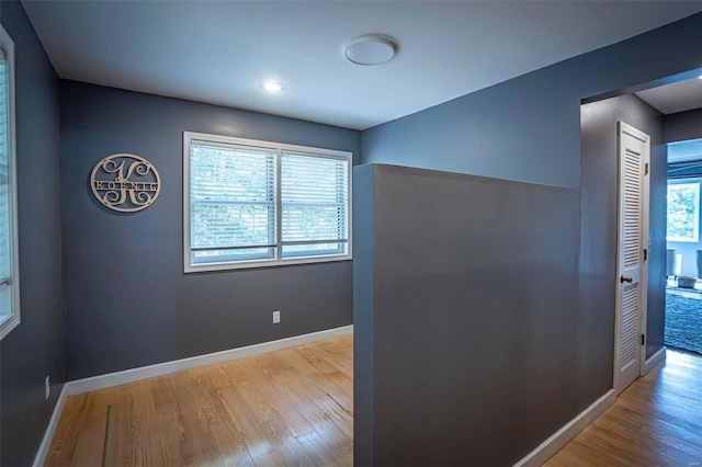 interior space featuring a healthy amount of sunlight and hardwood / wood-style floors