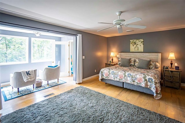 bedroom featuring ceiling fan and hardwood / wood-style floors