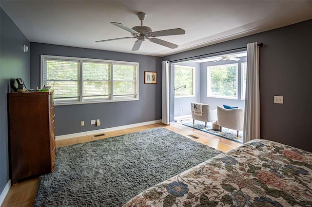 bedroom with ceiling fan and hardwood / wood-style floors