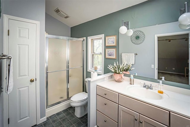 bathroom featuring lofted ceiling, vanity, toilet, and walk in shower