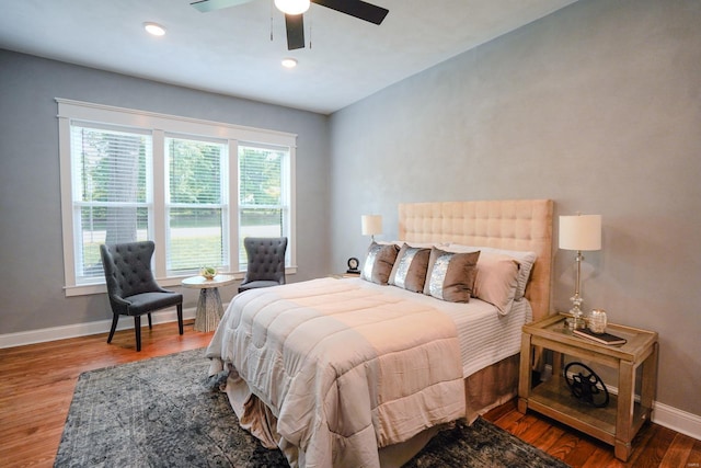 bedroom with hardwood / wood-style flooring and ceiling fan