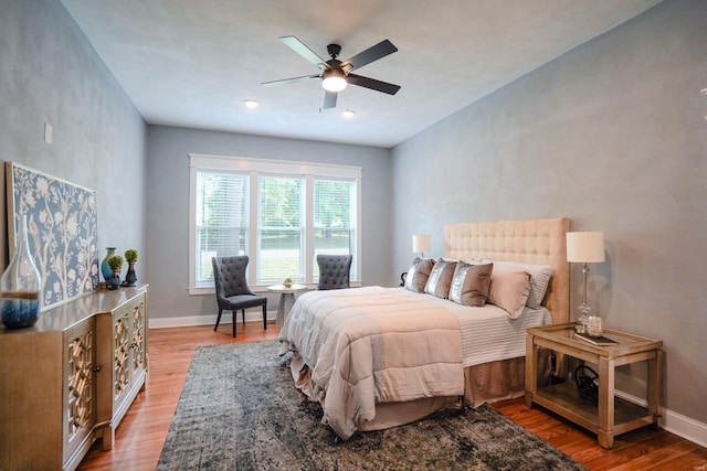 bedroom featuring ceiling fan and light hardwood / wood-style flooring