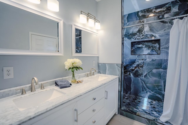 bathroom featuring walk in shower and vanity