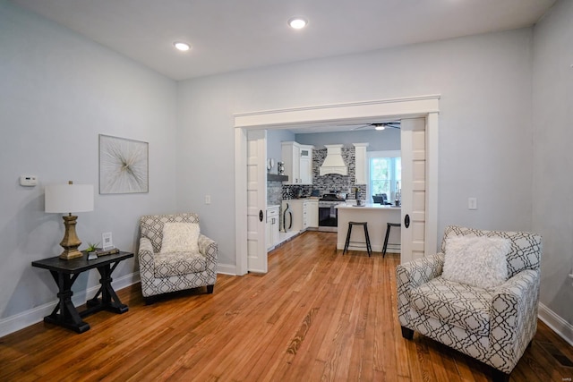 sitting room featuring light wood-type flooring