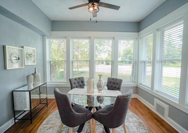 dining space featuring hardwood / wood-style flooring and ceiling fan