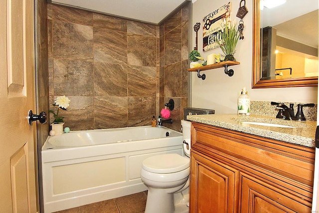 full bathroom with vanity, tiled shower / bath, tile patterned floors, and toilet