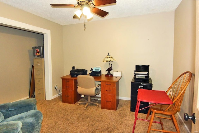 office featuring carpet floors, a textured ceiling, and ceiling fan