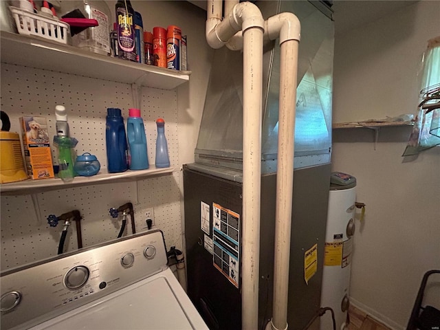 clothes washing area with heating unit, washer / dryer, and water heater