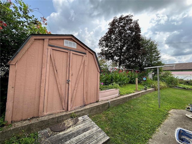 view of outbuilding with a lawn