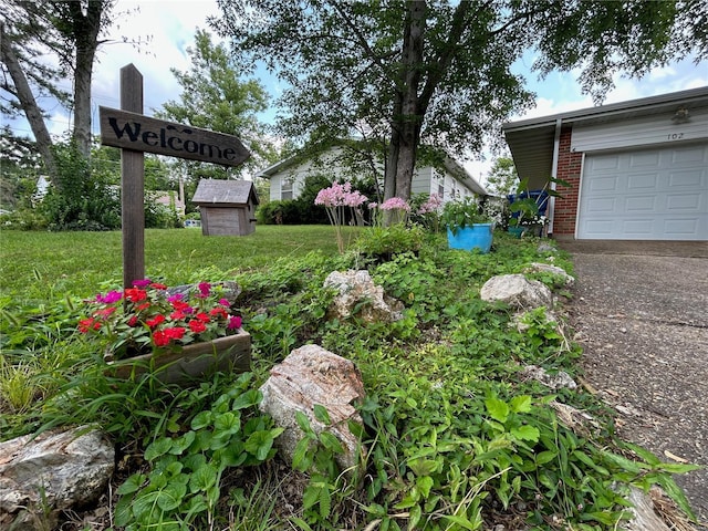 view of yard featuring a garage