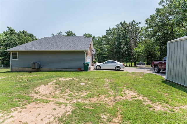 view of yard featuring central AC