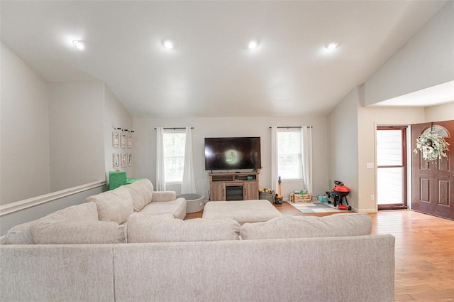 living room featuring light hardwood / wood-style flooring and plenty of natural light