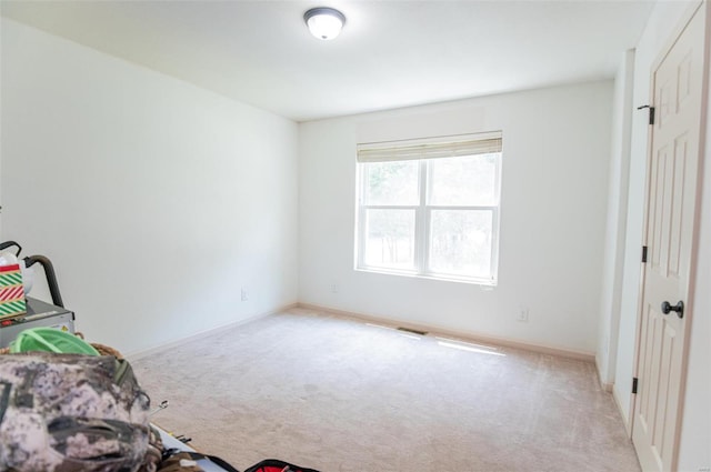 bedroom featuring light colored carpet