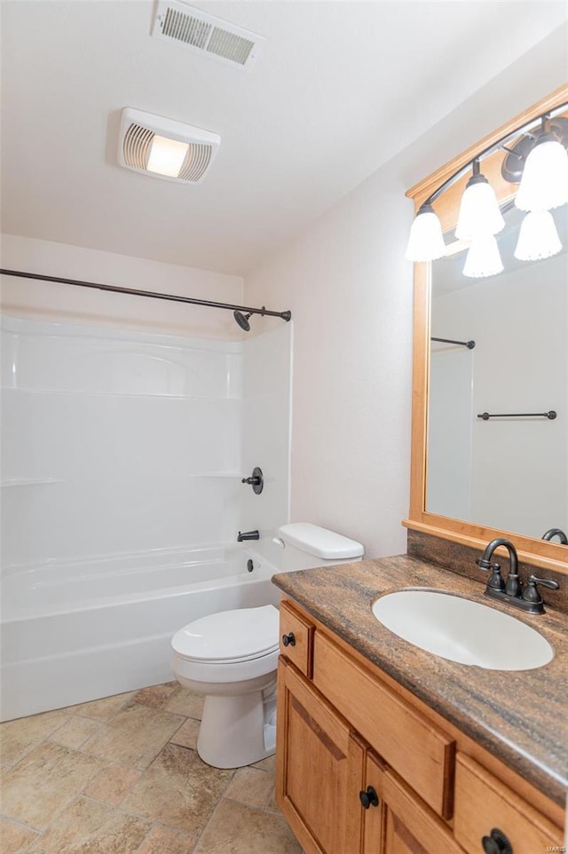 full bathroom featuring tile patterned floors, vanity, toilet, and washtub / shower combination