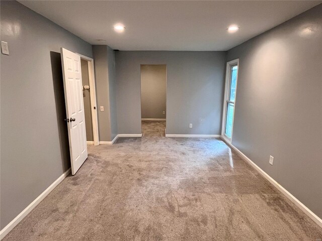 unfurnished bedroom with light carpet