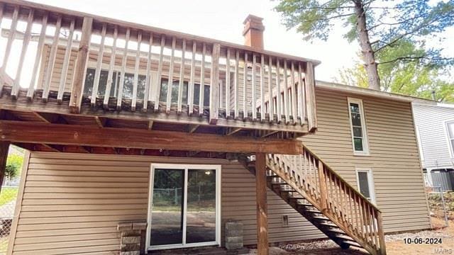 rear view of property with a deck