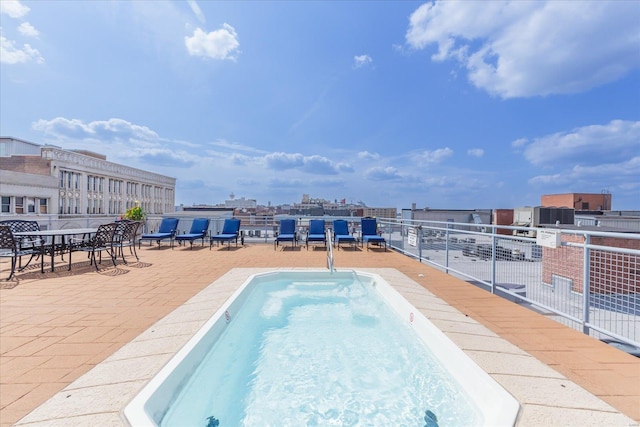 view of swimming pool with a patio area