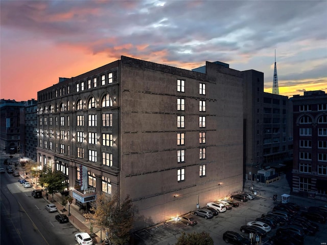 view of outdoor building at dusk