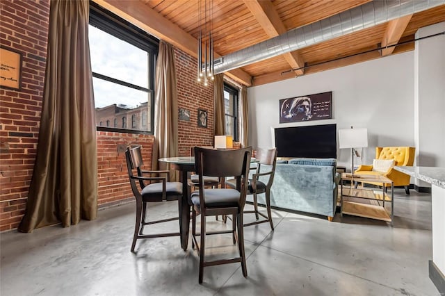 dining area with brick wall, concrete floors, beamed ceiling, and wood ceiling