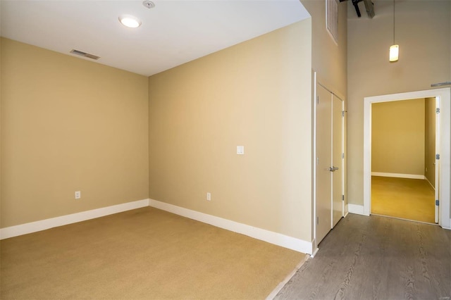 empty room with hardwood / wood-style flooring