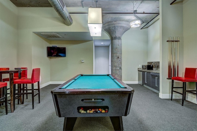 rec room featuring pool table, bar area, and dark carpet