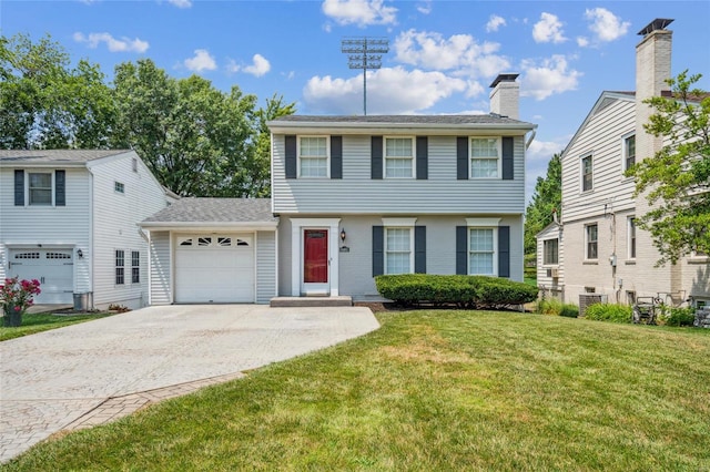 colonial inspired home featuring a garage, central AC, and a front yard