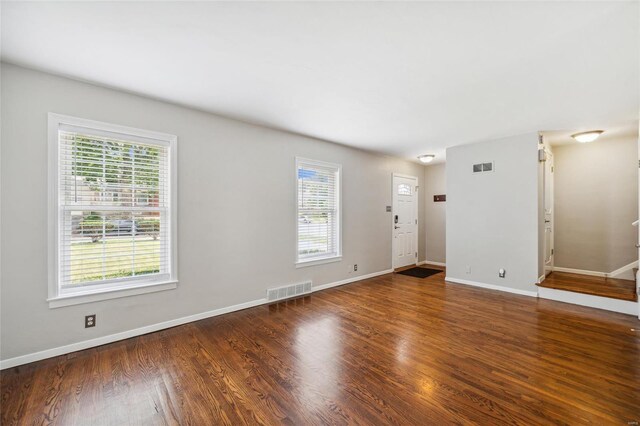 spare room with hardwood / wood-style flooring