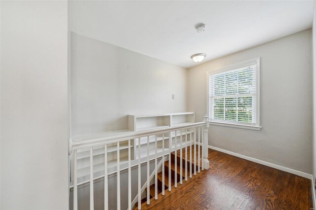 hall with dark hardwood / wood-style flooring