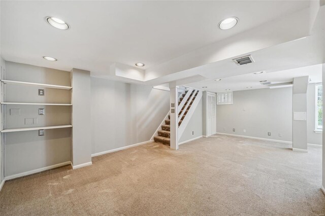 basement with light colored carpet