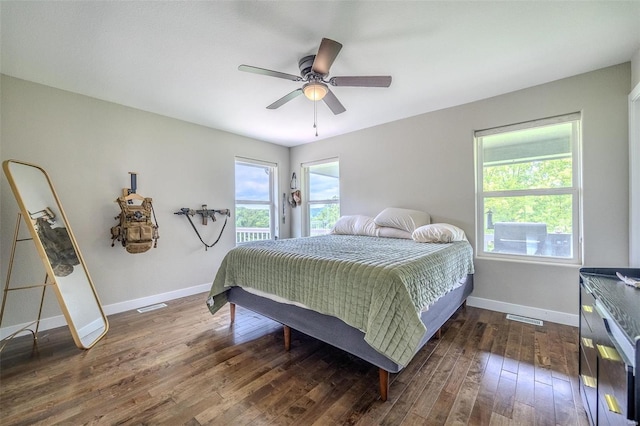 bedroom featuring ceiling fan and dark hardwood / wood-style flooring