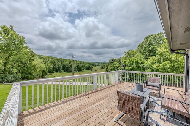 wooden terrace with a yard