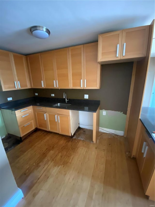 kitchen featuring sink, light hardwood / wood-style floors, and light brown cabinets