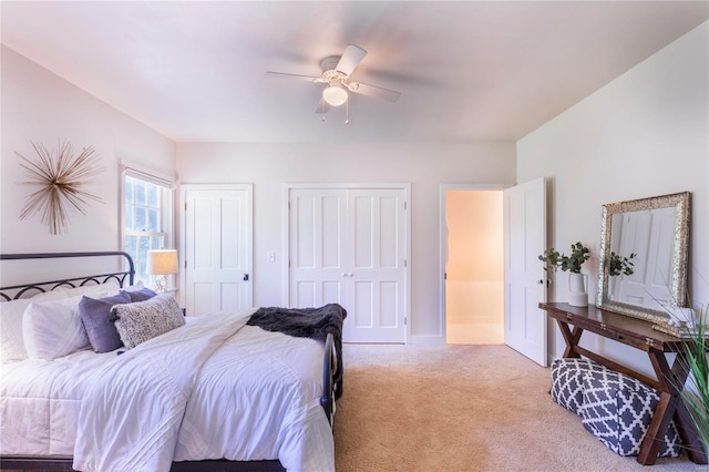 bedroom with ceiling fan and light colored carpet