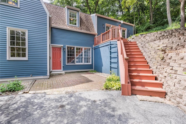 back of property with a patio