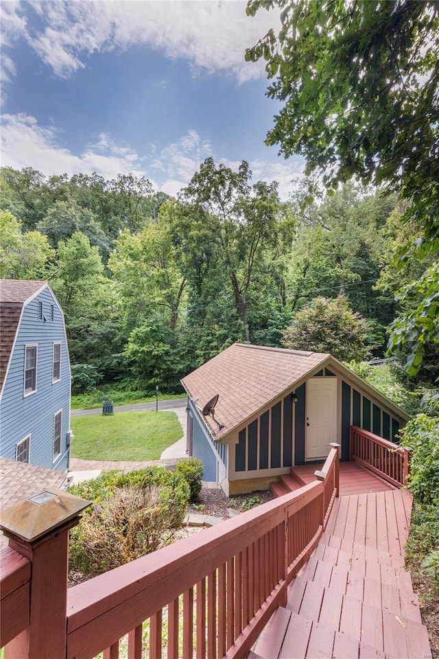 wooden deck featuring a yard