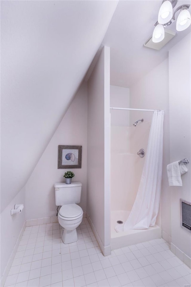 bathroom with walk in shower, lofted ceiling, tile patterned floors, and toilet