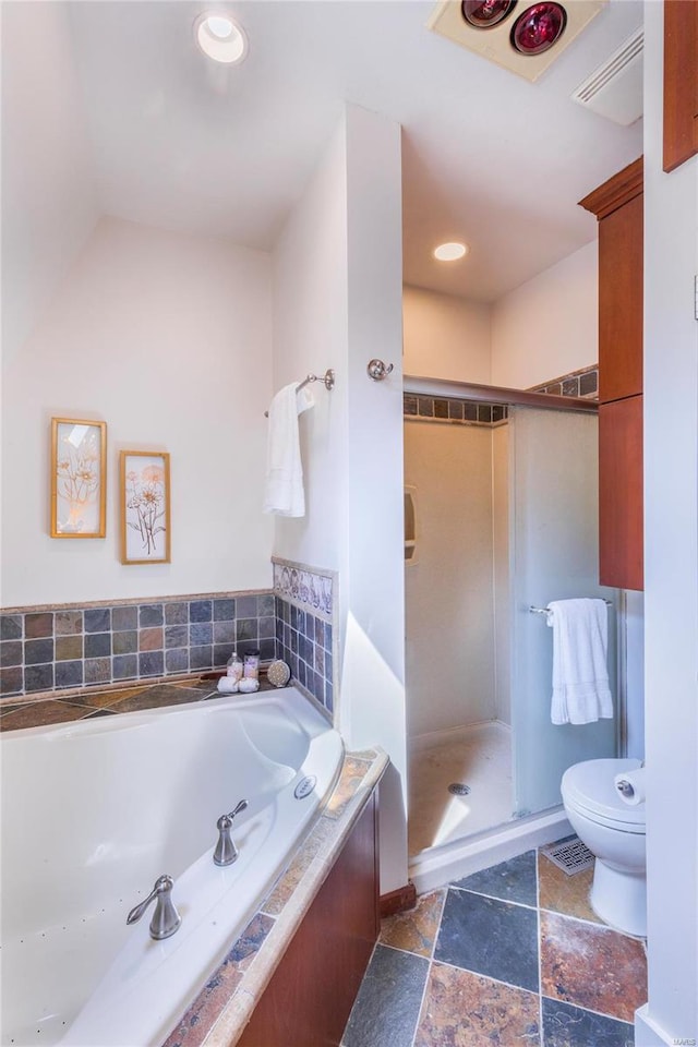 bathroom featuring plus walk in shower, toilet, and tile patterned floors