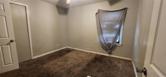 empty room featuring ceiling fan and carpet floors