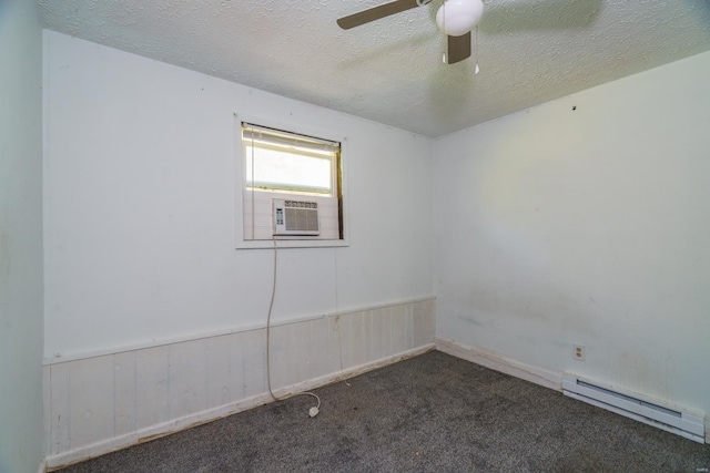 carpeted empty room with a textured ceiling, cooling unit, ceiling fan, and a baseboard heating unit